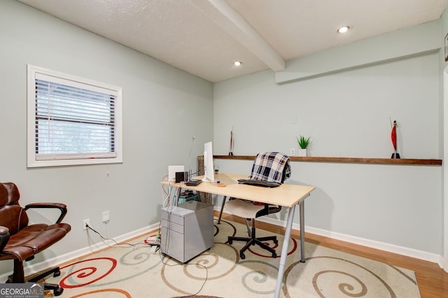 office area featuring beamed ceiling and light wood-type flooring