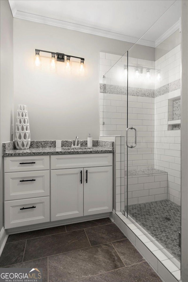 319 S Madison Ave, Monroe, GA 30655 - bathroom with ornamental molding, a shower stall, and vanity
