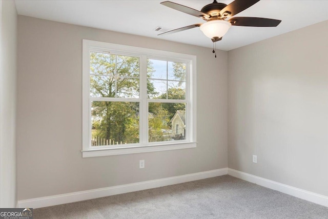319 S Madison Ave, Monroe, GA 30655 - carpeted empty room featuring a ceiling fan and baseboards