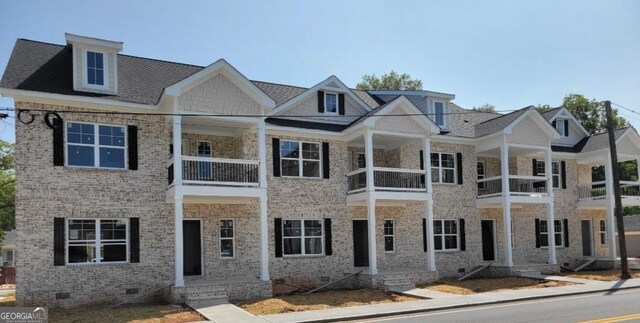 view of front of home with a balcony