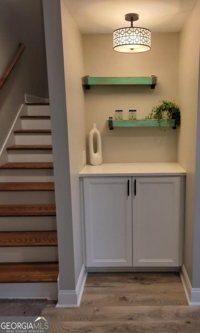 319 S Madison Ave, Monroe, GA 30655 - stairway with wood finished floors and baseboards