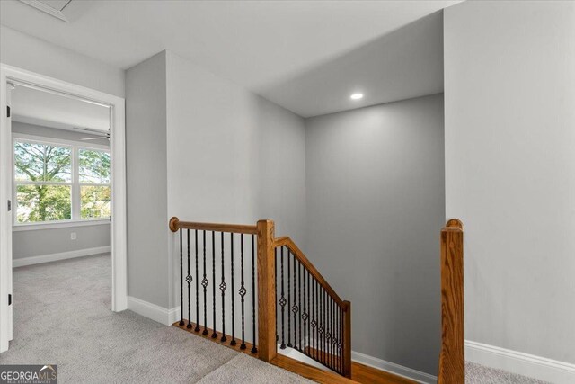 319 S Madison Ave, Monroe, GA 30655 - corridor with an upstairs landing, baseboards, carpet floors, and recessed lighting