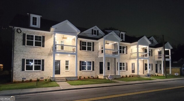 319 S Madison Ave, Monroe, GA 30655 - view of front of home with a balcony, ceiling fan, and brick siding