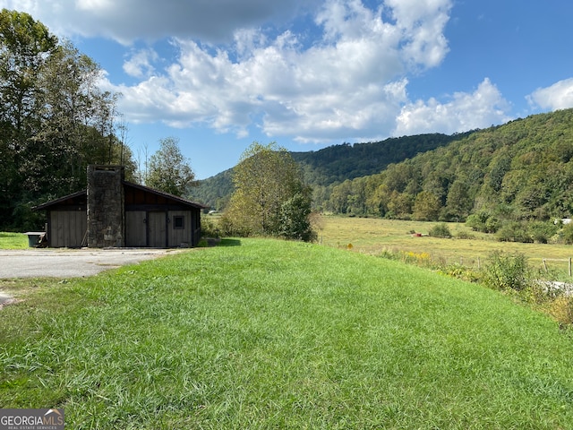 property view of mountains featuring a rural view