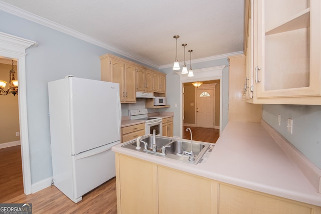 kitchen featuring white appliances, light wood-type flooring, kitchen peninsula, and decorative light fixtures