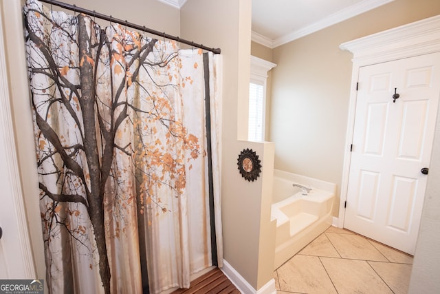 bathroom featuring ornamental molding, tile patterned floors, and a tub