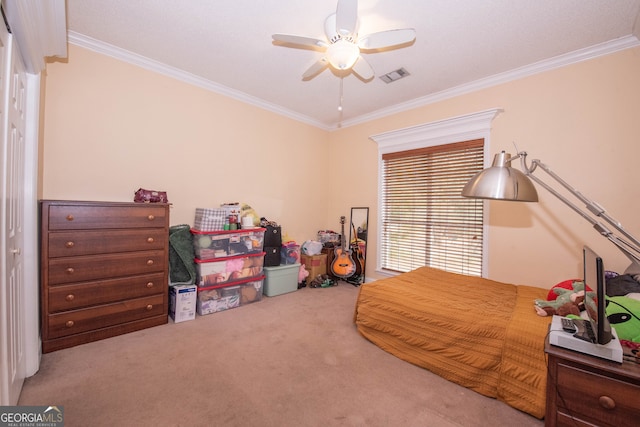 carpeted bedroom featuring ceiling fan and ornamental molding