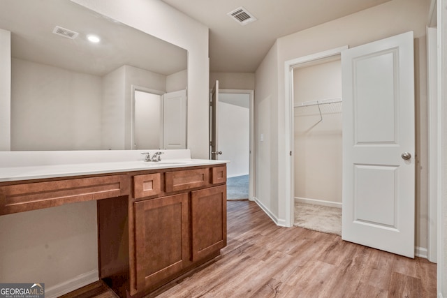 bathroom featuring vanity and hardwood / wood-style flooring