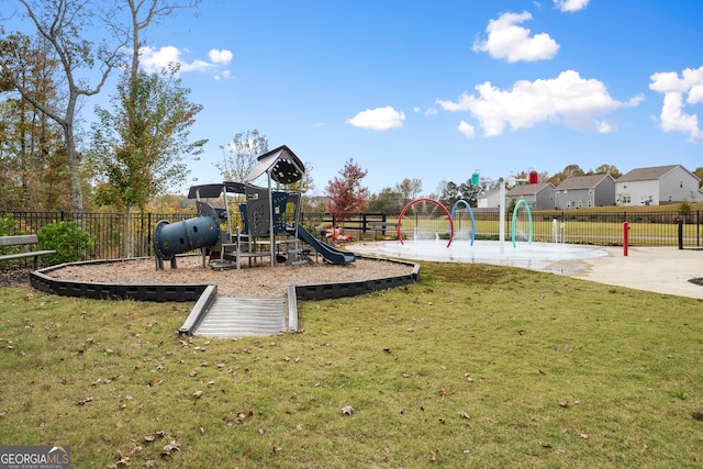 view of jungle gym featuring a lawn