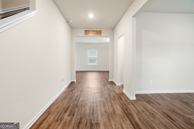 corridor featuring dark wood-type flooring