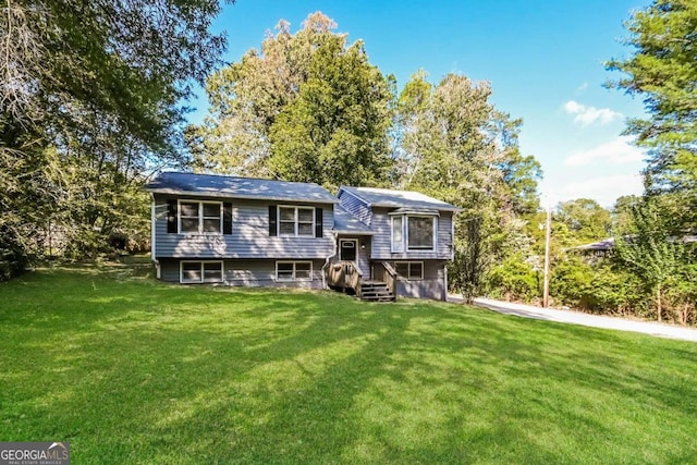 bi-level home with a front yard