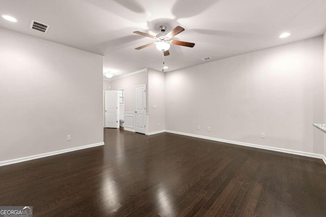 unfurnished room featuring dark hardwood / wood-style floors and ceiling fan