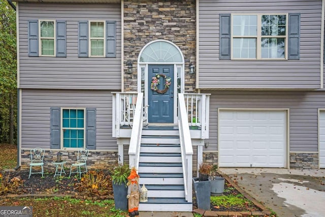 doorway to property featuring a garage