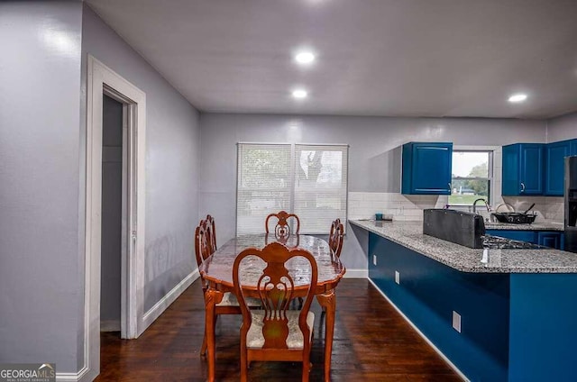 dining area featuring dark hardwood / wood-style floors