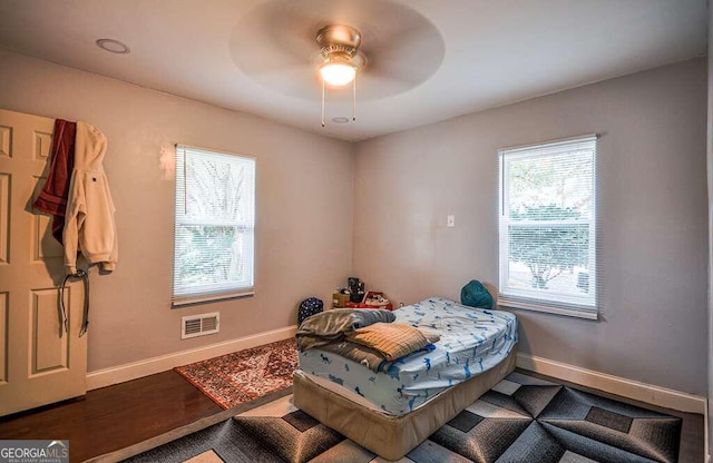 bedroom featuring hardwood / wood-style flooring and ceiling fan