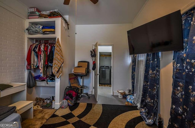 interior space with ceiling fan and vaulted ceiling