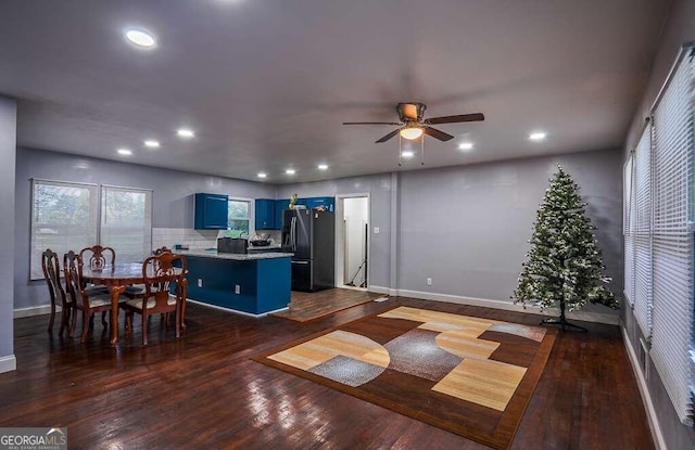 interior space with dark hardwood / wood-style flooring and ceiling fan