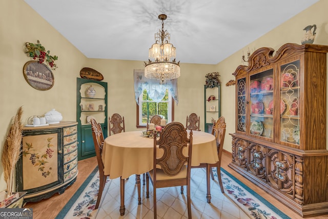 dining space with a notable chandelier