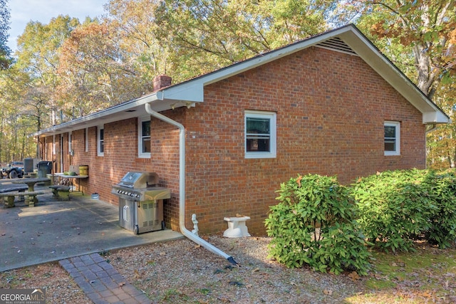 view of property exterior featuring a patio