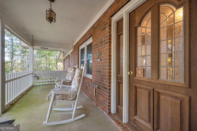 doorway to property featuring covered porch