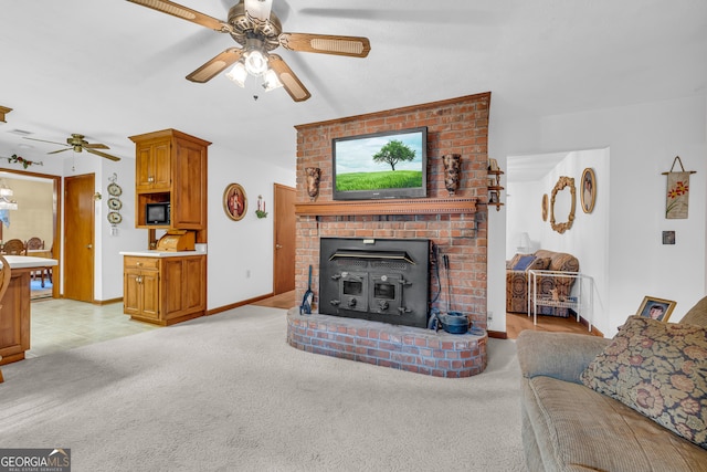 carpeted living room with ceiling fan