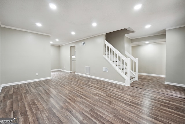 interior space with ornamental molding and dark hardwood / wood-style floors