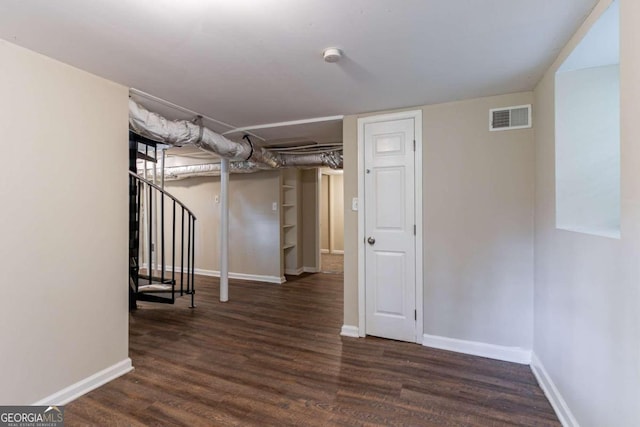 basement featuring dark hardwood / wood-style floors