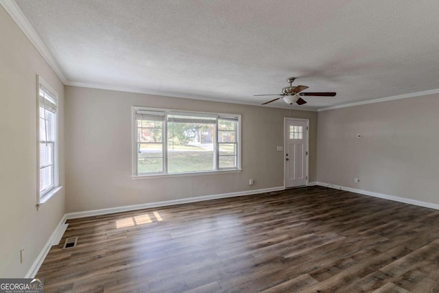 interior space with dark hardwood / wood-style flooring, a textured ceiling, ceiling fan, and crown molding