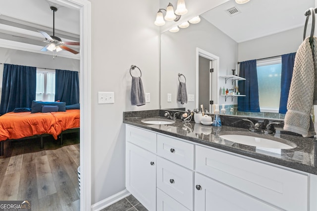 bathroom with hardwood / wood-style floors, vanity, and ceiling fan