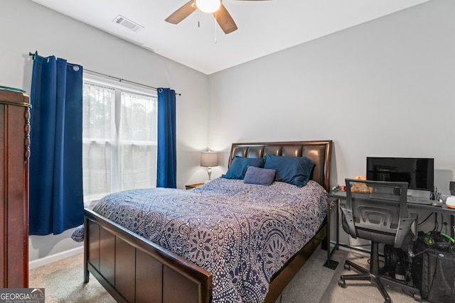 bedroom with light colored carpet and ceiling fan