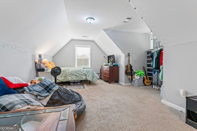 bedroom with carpet and lofted ceiling