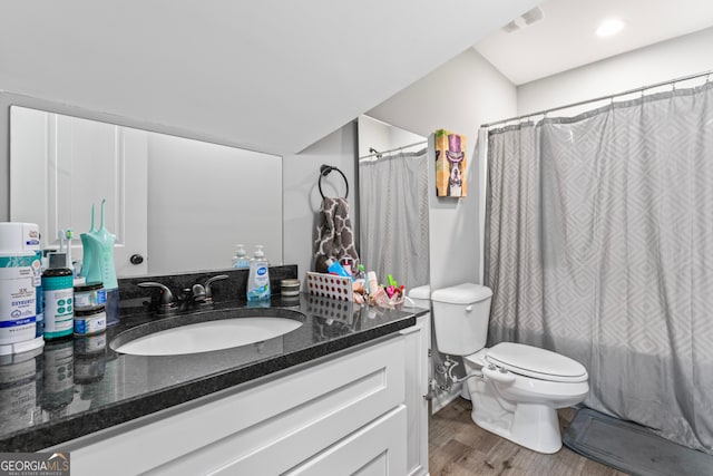 bathroom with a shower with curtain, vanity, toilet, and wood-type flooring