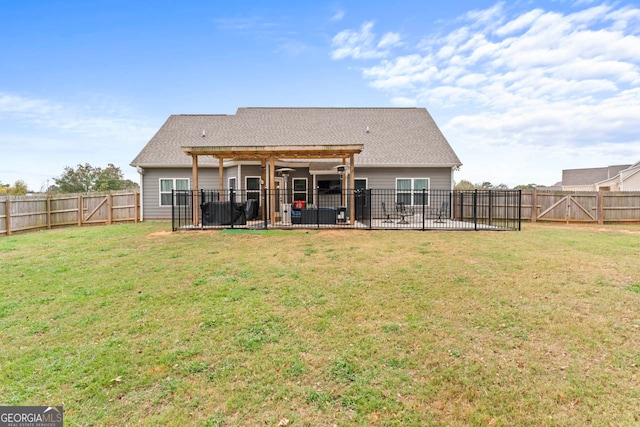 back of house featuring a patio area and a yard