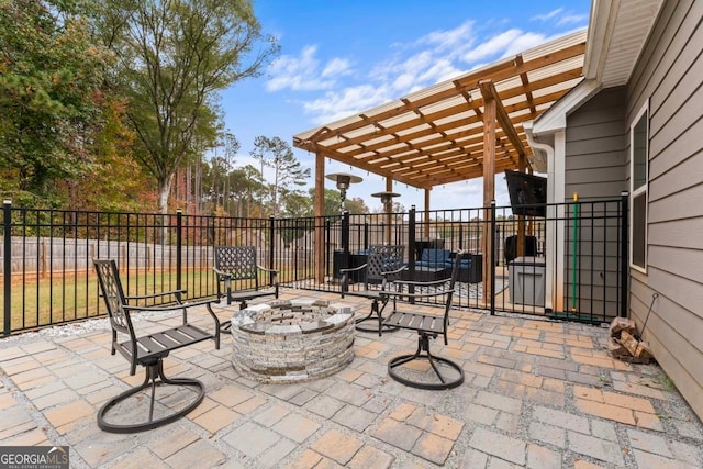 view of patio / terrace with a pergola and a fire pit