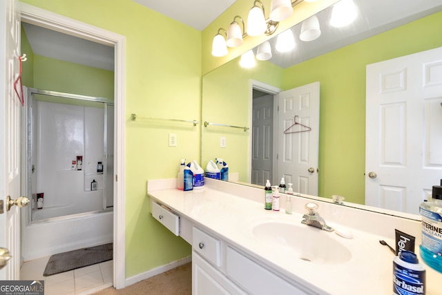 bathroom with vanity, tile patterned flooring, and enclosed tub / shower combo