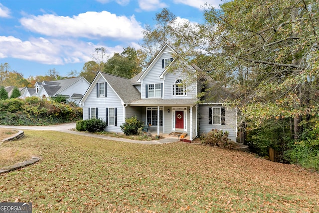 view of property featuring a front lawn