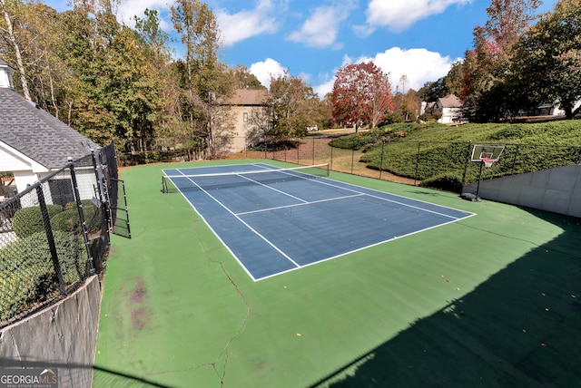 view of sport court featuring basketball hoop