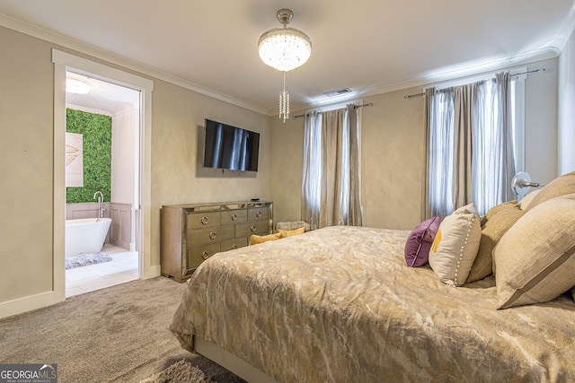 bedroom featuring light colored carpet, ornamental molding, and ensuite bath