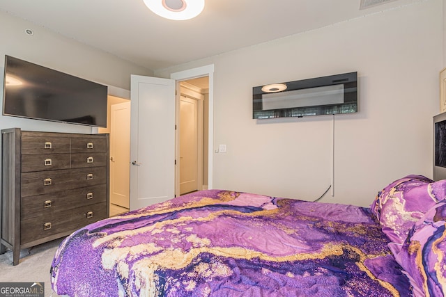 bedroom featuring light colored carpet