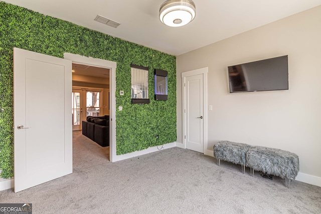 carpeted empty room with french doors