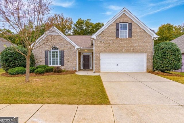 view of front property with a garage and a front yard