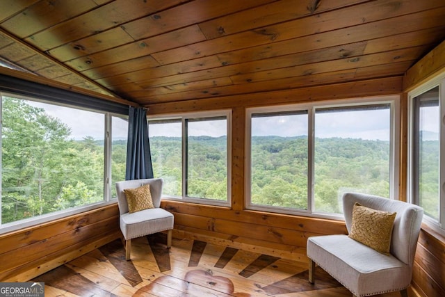 sunroom / solarium with plenty of natural light and wood ceiling