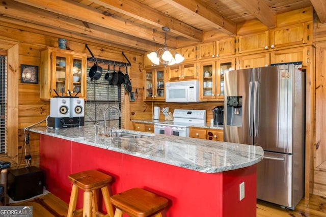 kitchen featuring a kitchen island, wood ceiling, sink, beamed ceiling, and white appliances