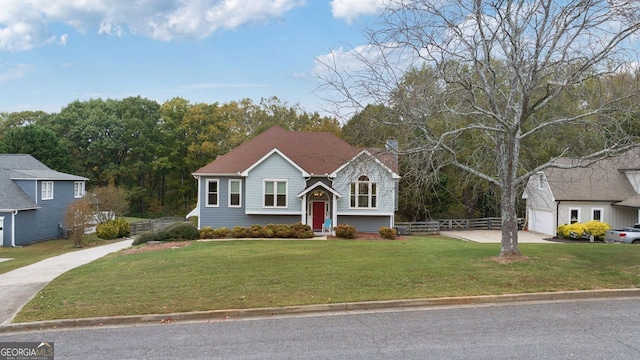 view of front of home featuring a garage and a front yard