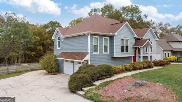 view of front property with a front lawn and a garage