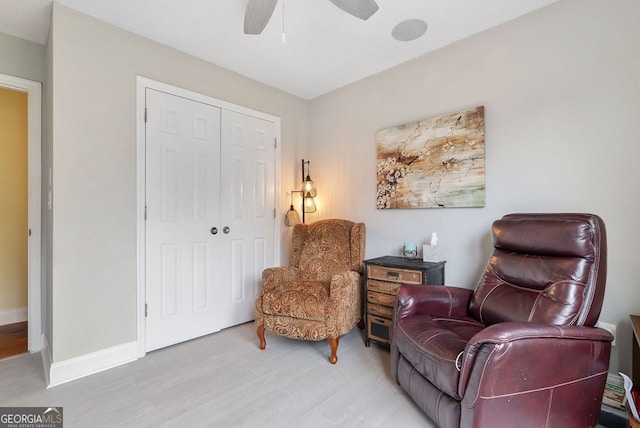 sitting room featuring ceiling fan and light hardwood / wood-style flooring