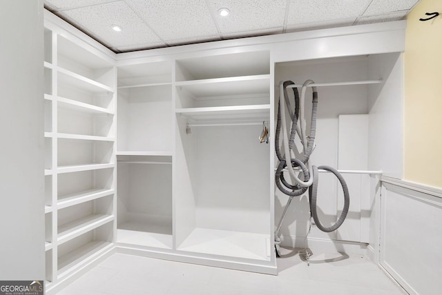 spacious closet featuring a paneled ceiling