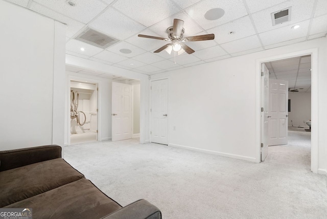 carpeted living room featuring a paneled ceiling and ceiling fan