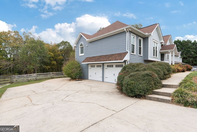 view of side of home with a garage