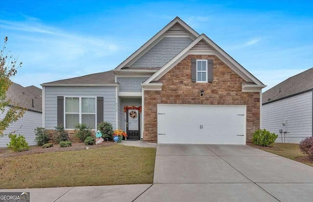 view of front of property featuring a garage and a front lawn